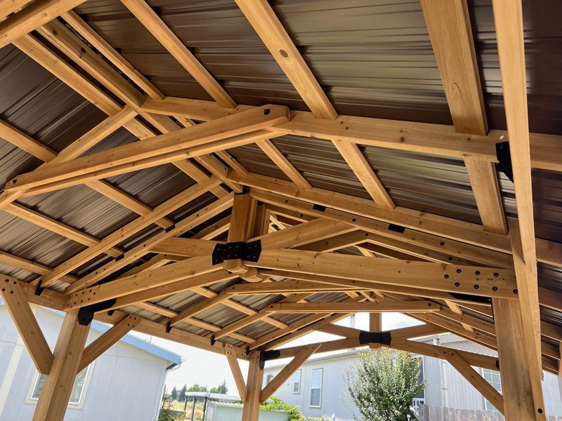 Timber-frame pavilion roof framing, built by High Desert Fix for a mobile home community