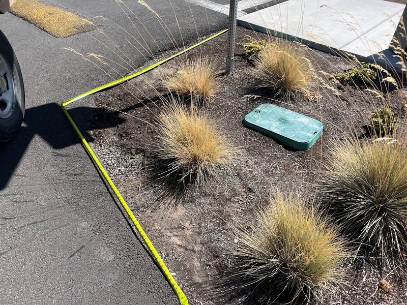 Parking lot island curb work at a commercial site